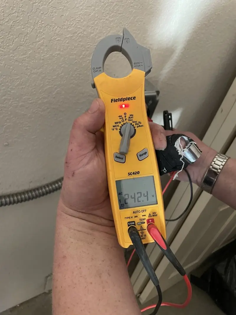 Voltage testing with clamp meter during Electrical Installation Services in Frankfort